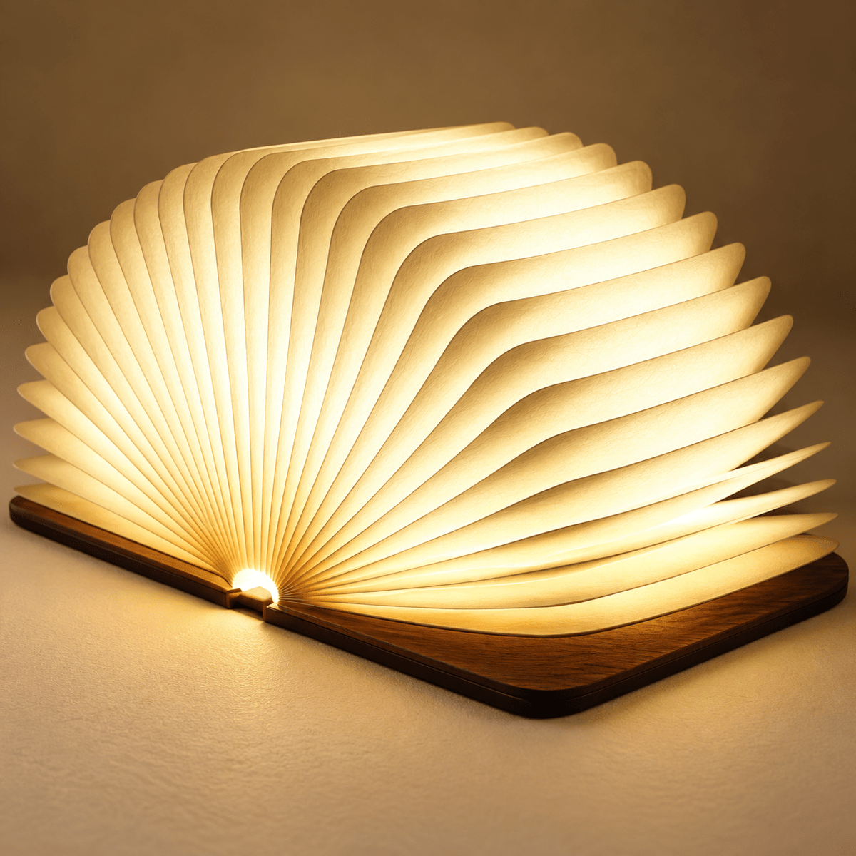 Close-up of warm ivory accordion paper in a walnut book lamp