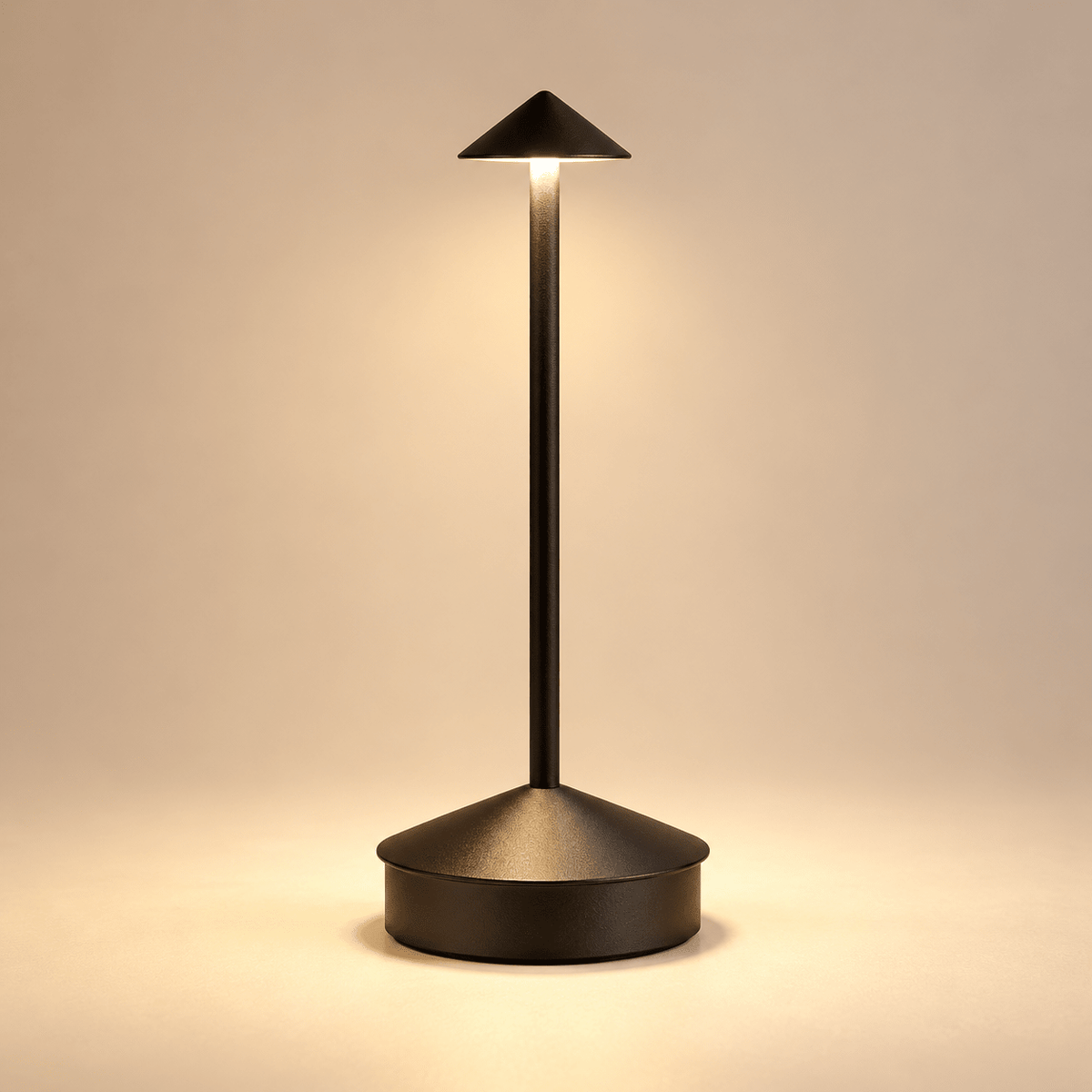 black finish single lamp from the right side of reference, tiny low conical shade on slim straight stem with broad cylindrical base with conical top