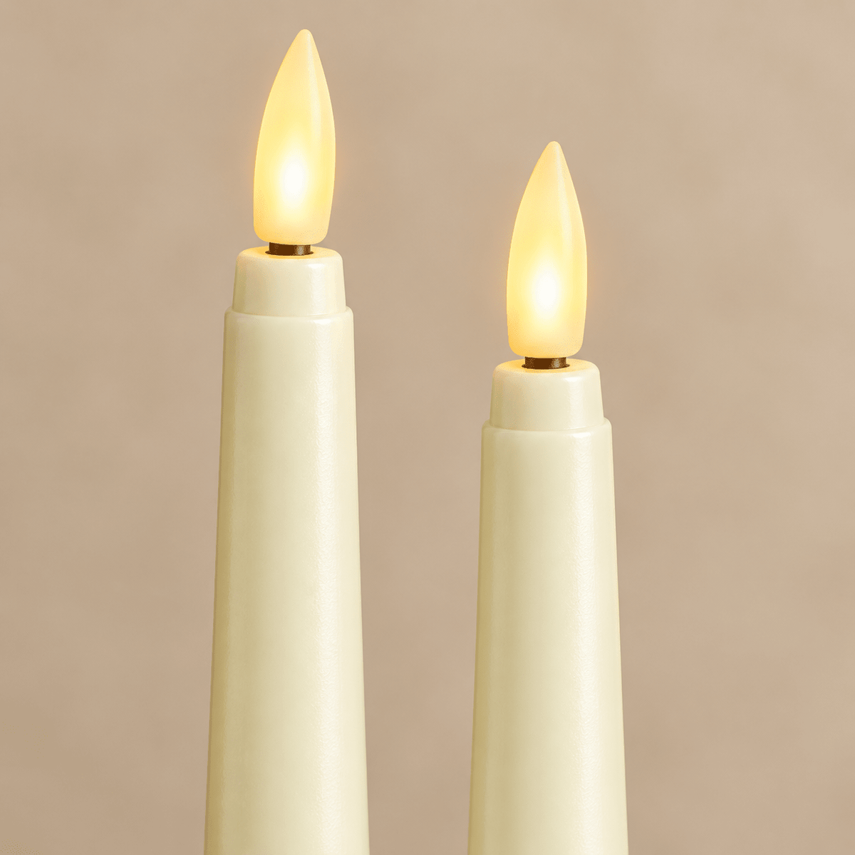 Close view of ivory flameless taper bodies and warm LED wicks